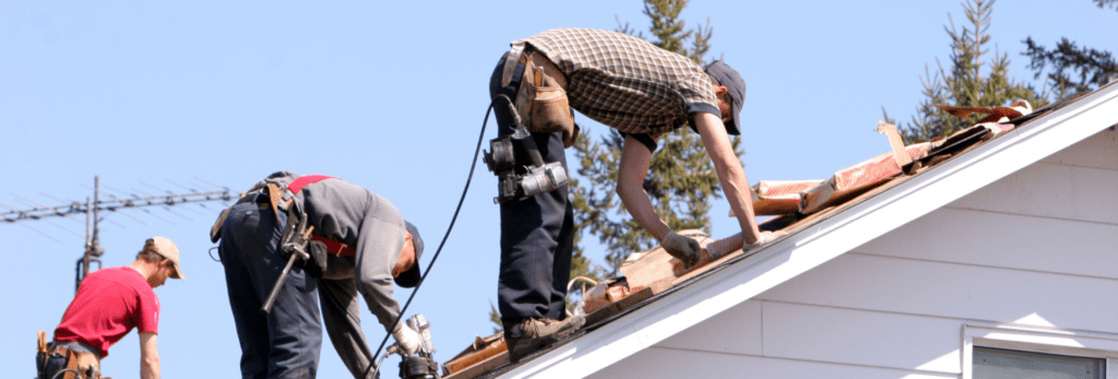 ResCom workers replacing roof shingles